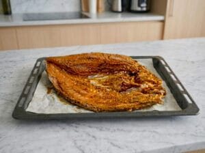 Brushing fish with Chermoula inside and out