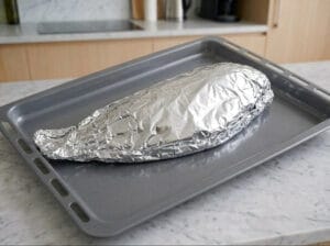 Wrapping fish in parchment paper and foil