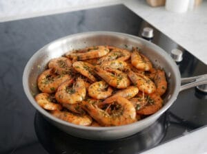 Sautéed shrimp in a frying pan