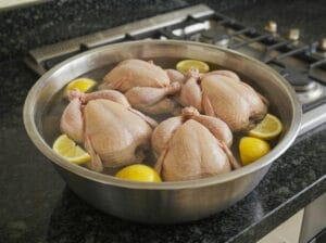 Soaking the chicken in salted water with fresh lemon