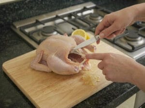 Cleaning the chicken from slimy substances and blood