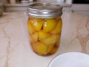Pour the lemon juice over the packed lemons in the jar