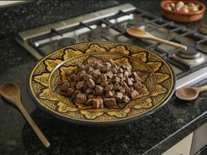 Cutting the chicken liver after boiling it and