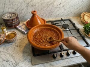 A traditional tagine with fresh tomato sauce and aromatic spices