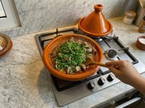 Diced beef liver tagine garnished with finely chopped parsley