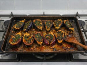 halves of small eggplant with chermoula cooked in a baking tray
