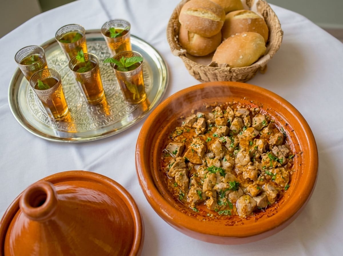 Beef liver tagine cooked in a rich tomato-based sauce, served in a traditional clay pot