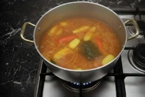 A pot of simmering Moroccan couscous broth