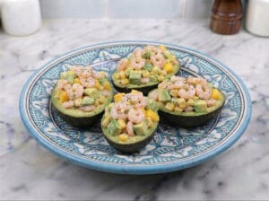 Avocado halves stuffed with shrimp and diced mango