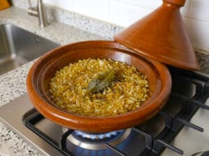 Tagine base with golden caramelized onions