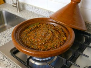 Tagine featuring a rich tomato sauce seasoned with Moroccan chermoula
