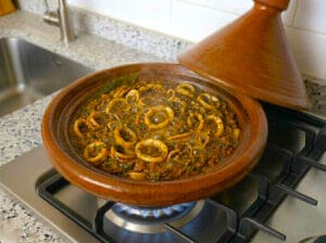 Traditional Moroccan tagine with calamari rings in a rich tomato sauce
