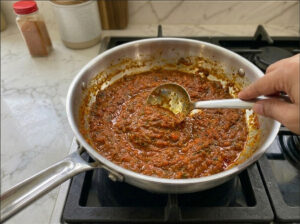 A pan with rich, cooked-down tomato sauce