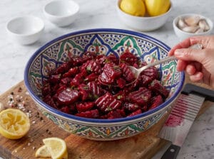 Beetroot wedges seasoned with lemon juice and finely minced garlic in a large serving bowl