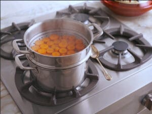 Carrot rounds steaming in a Moroccan keskass