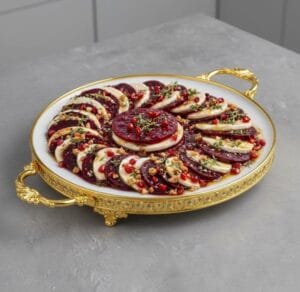 Beetroot slices with buffalo mozzarella slices on a serving platter