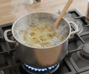 Fettuccine pasta boiling in a pot of water