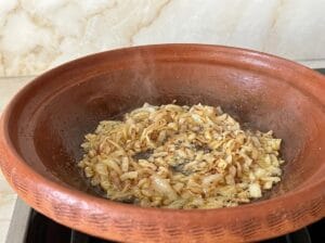 Tagine with oil and finely chopped golden-brown onion