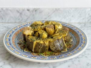 Conger eel fish pieces with marinade in a Moroccan plate